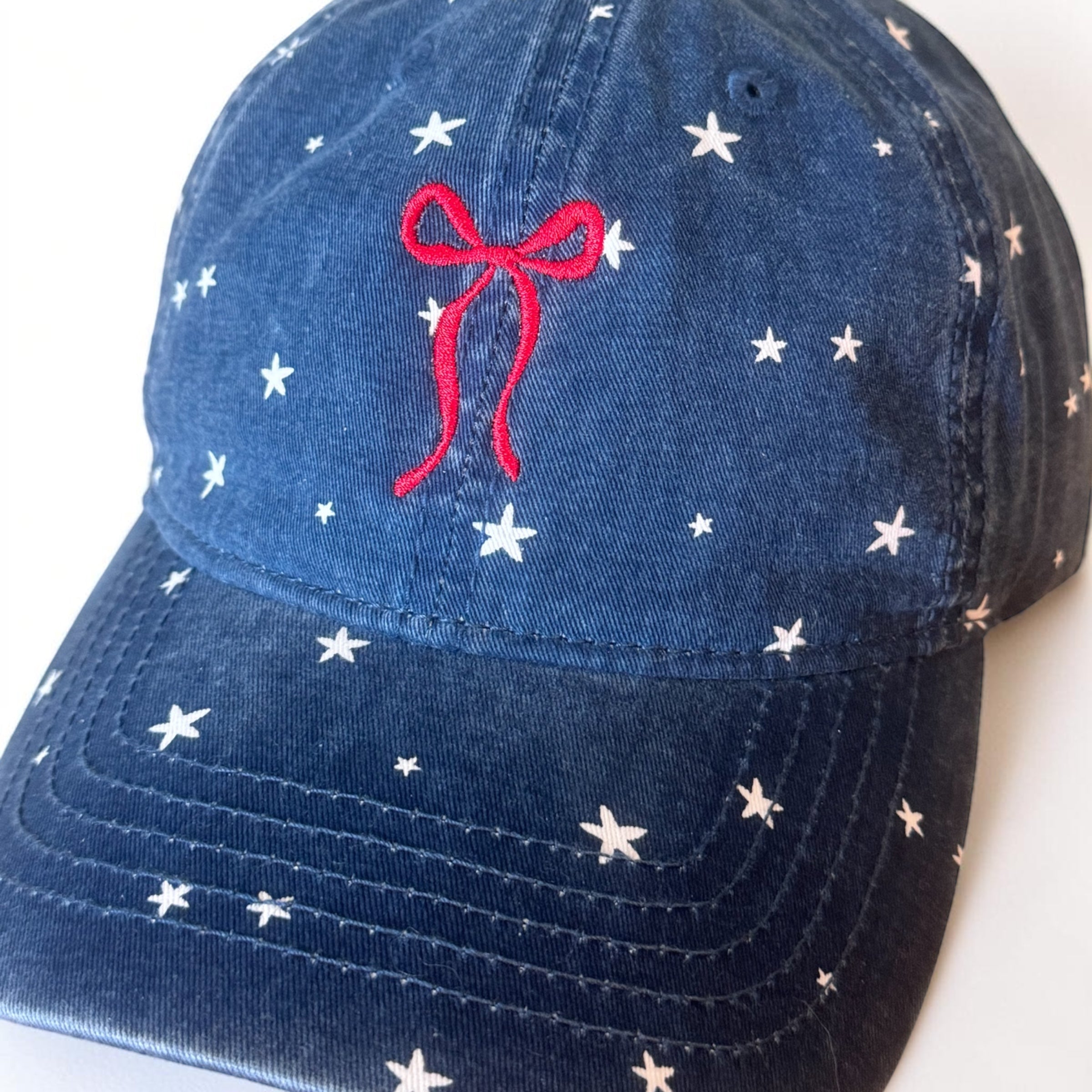 Embroidered bow with stars hat with ponytail opening